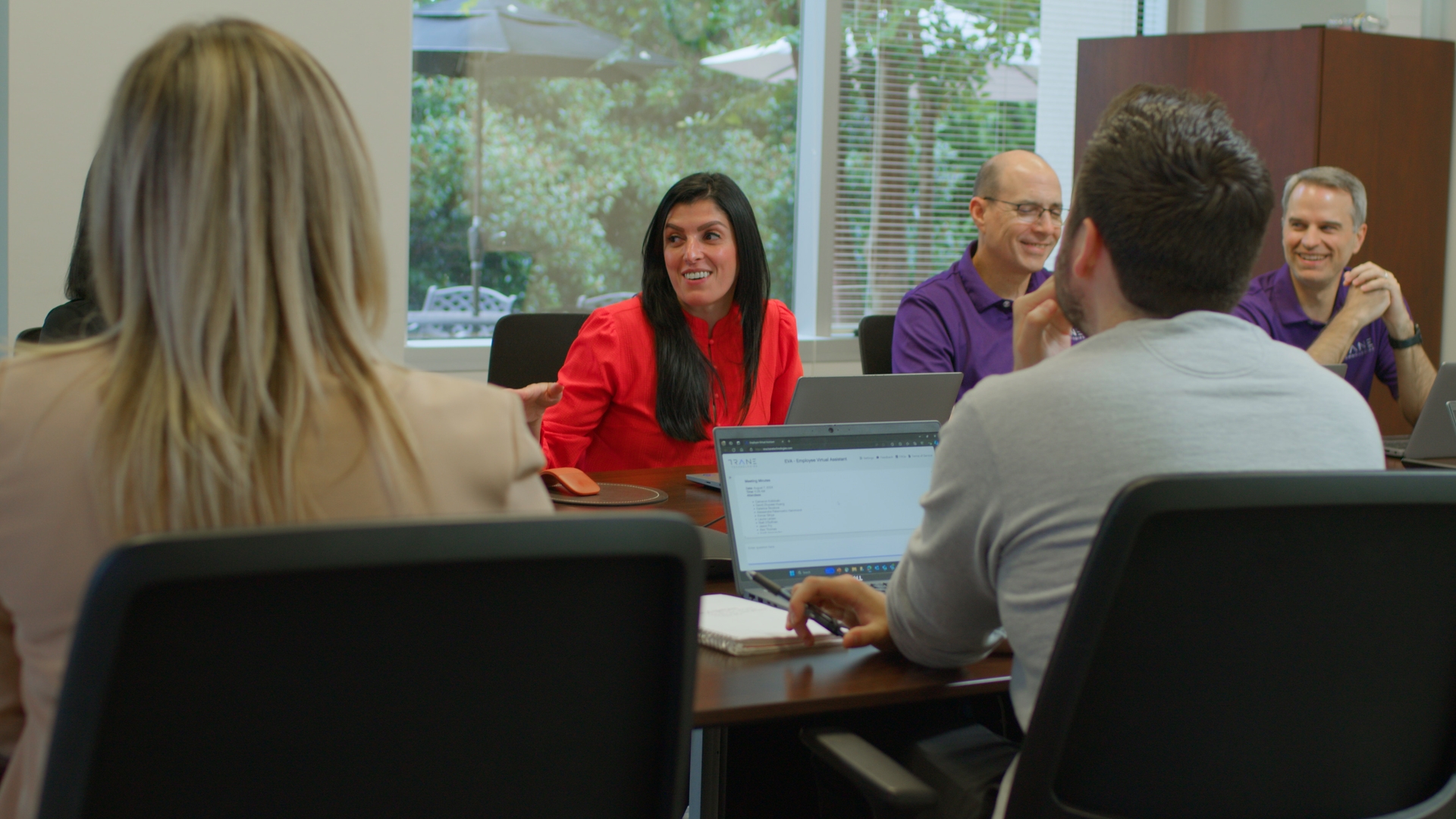 Alessandra Hammond leading her team in a brainstorming session