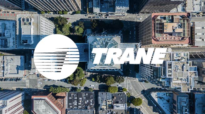 Trane logo over aerial view of city buildings