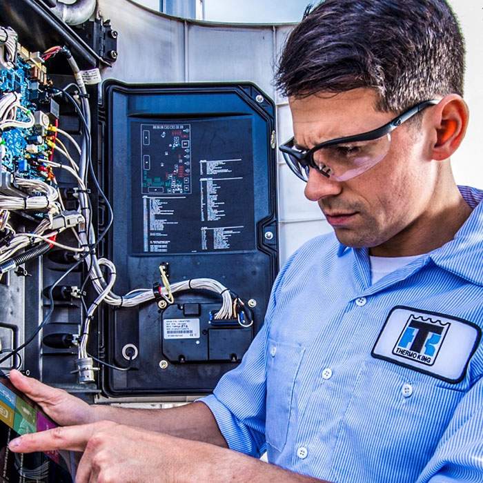 Thermo King employee fixing control panel